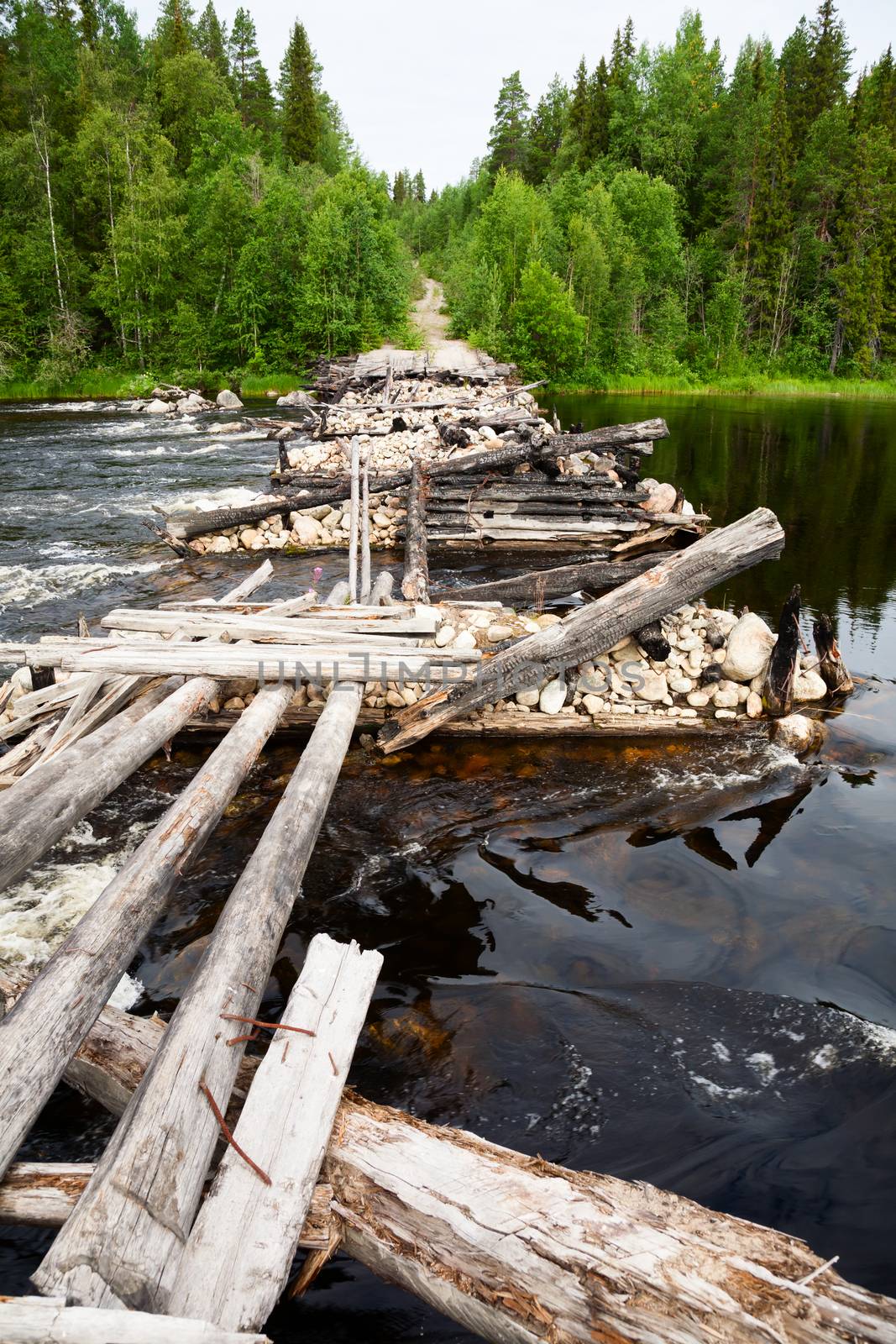 Old demolished bridge in Karelia, Russia