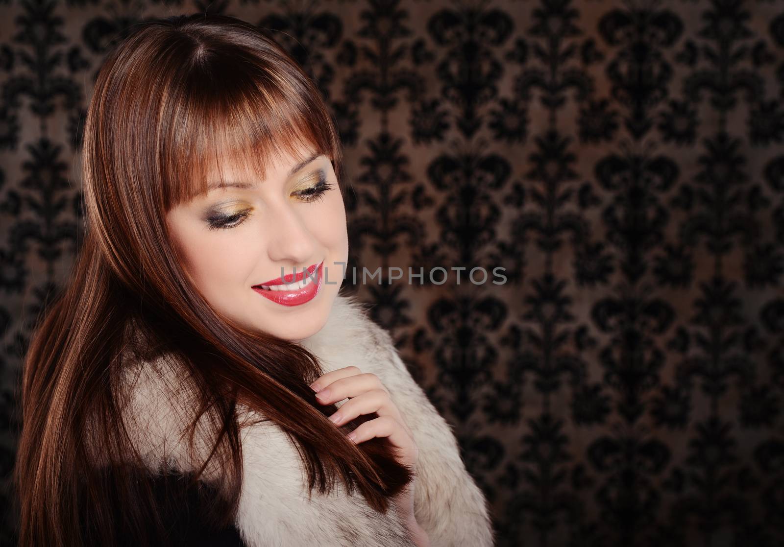 Beautiful woman in retro style over dark vintage background