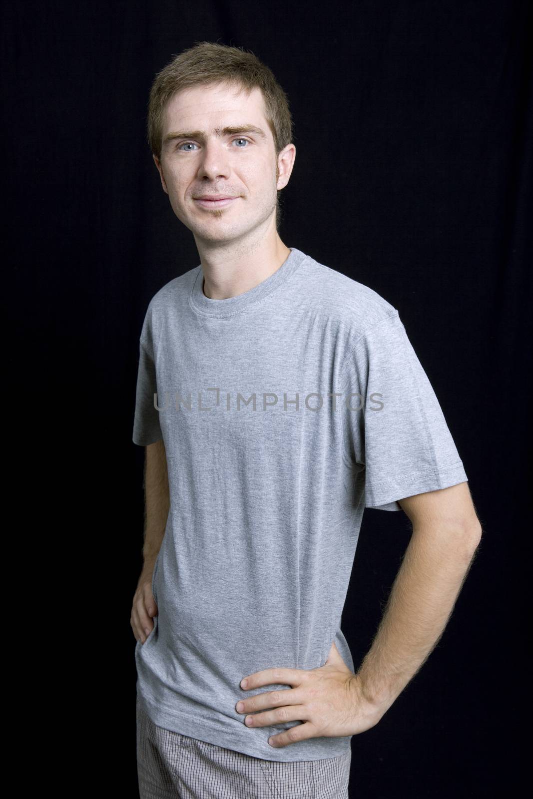 young man portrait, on a black background