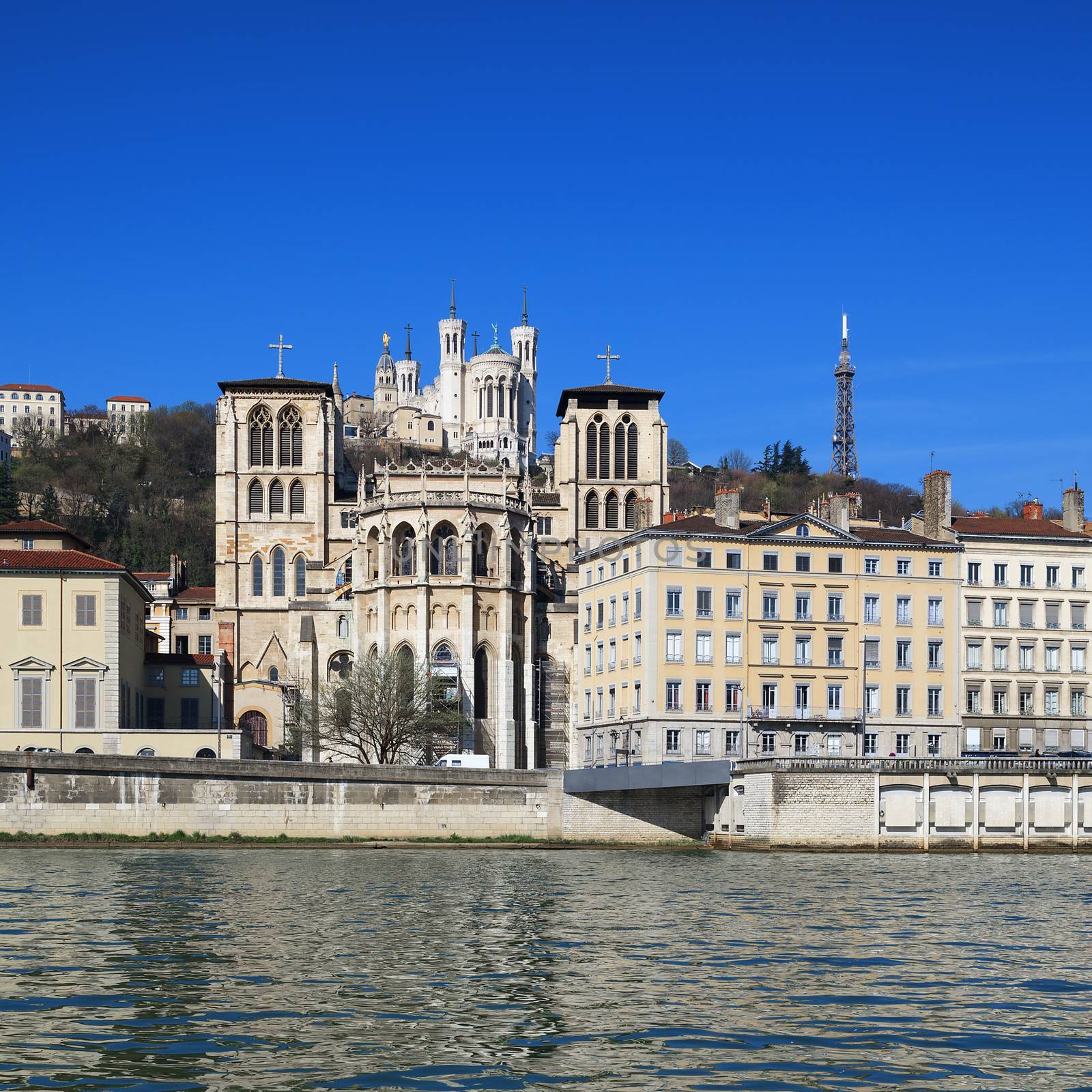 The apse of the Saint Jean cathedral, next to the Saone river, is dominated by the Fourviere basilica