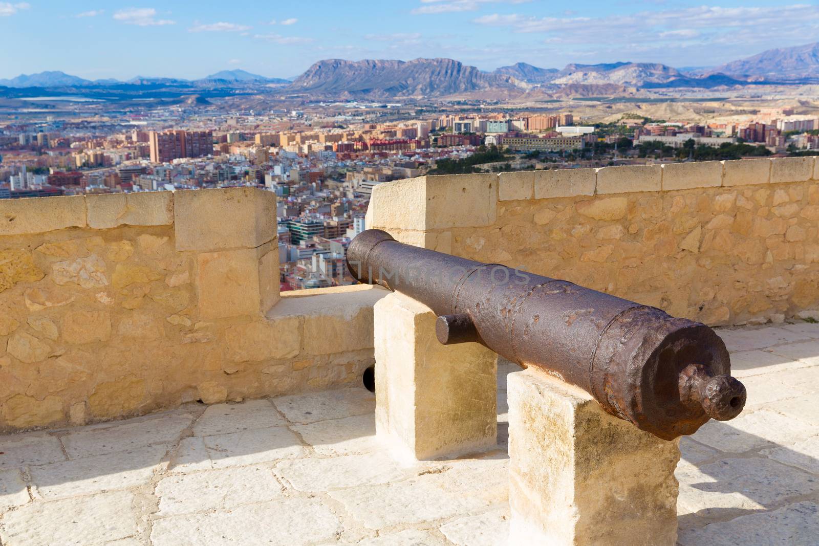 Alicante skyline and old canyons of Santa Barbara Castle by lunamarina