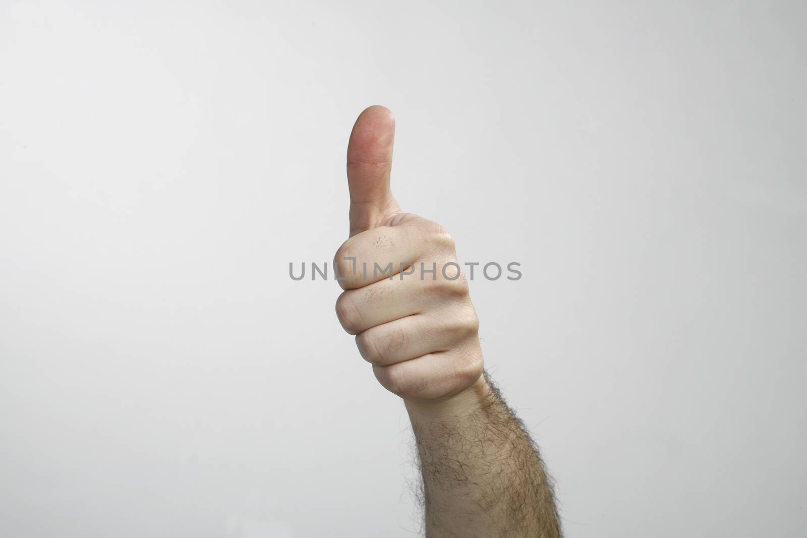 Hand with thumb up isolated on white background by nemar74