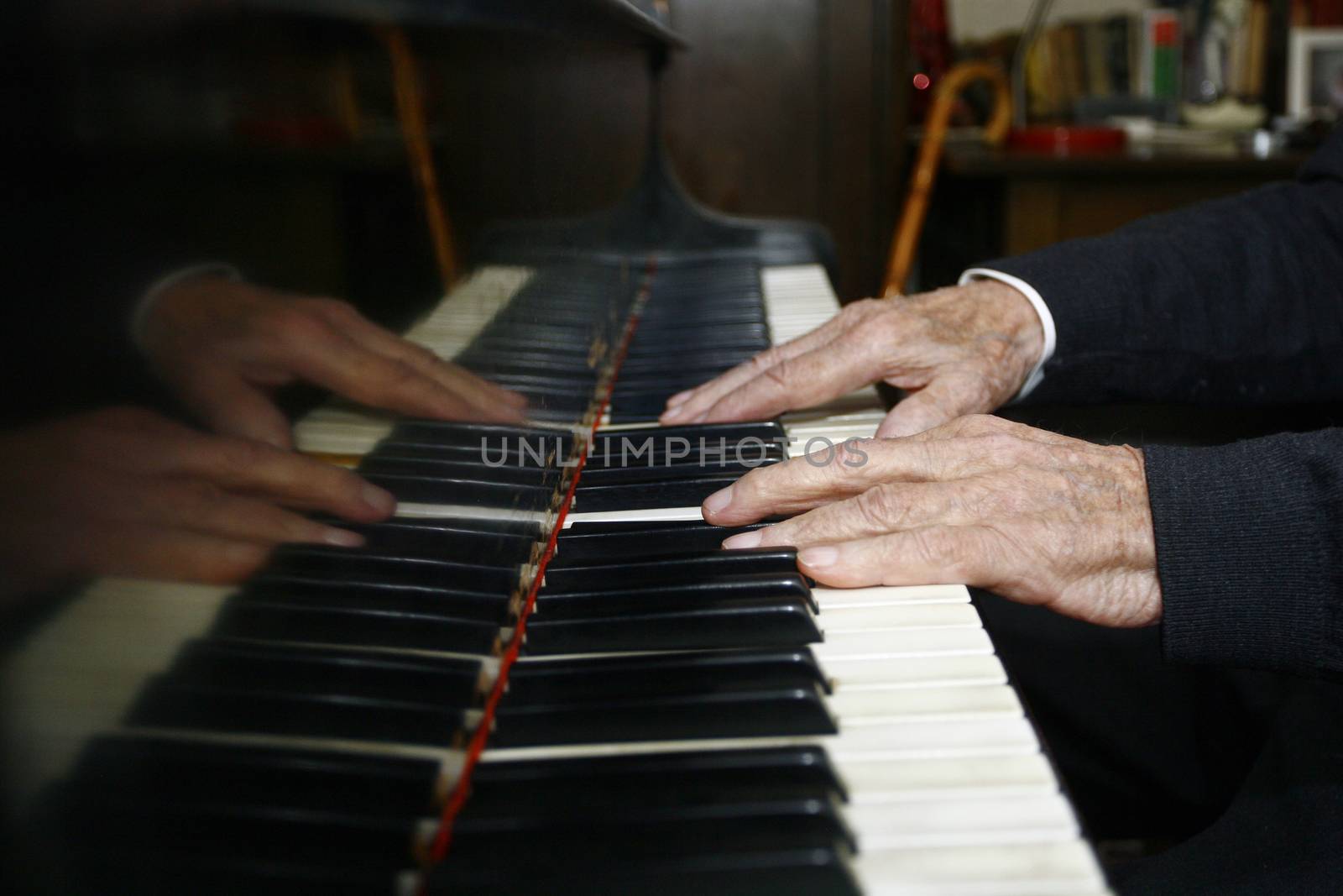 Old Male hands playing the piano by nemar74