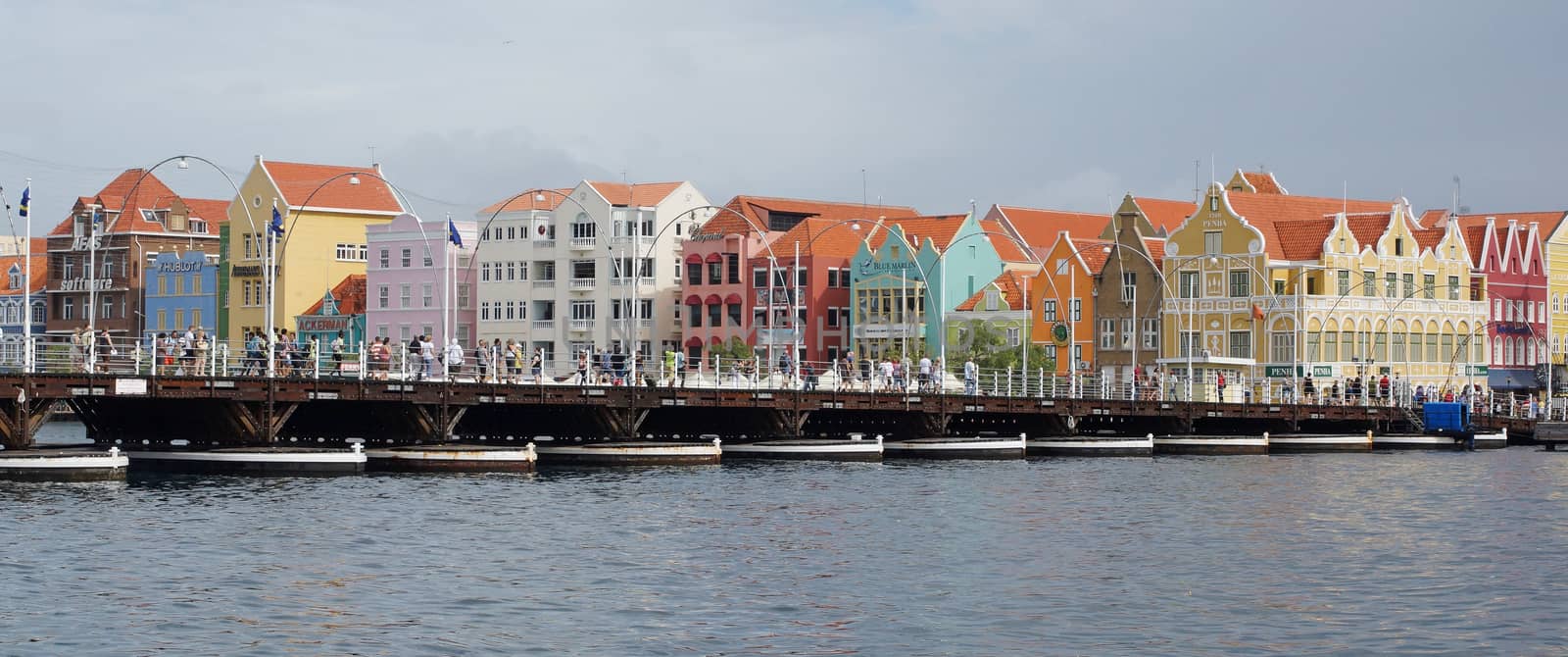 WILLEMSTAD, CURACAO - DECEMBER 10, 2013: Panorama of the Queen Emma Bridge in front of the Punda district on December 10, 2013 in Willemstad, Curacao, ABC Islands,