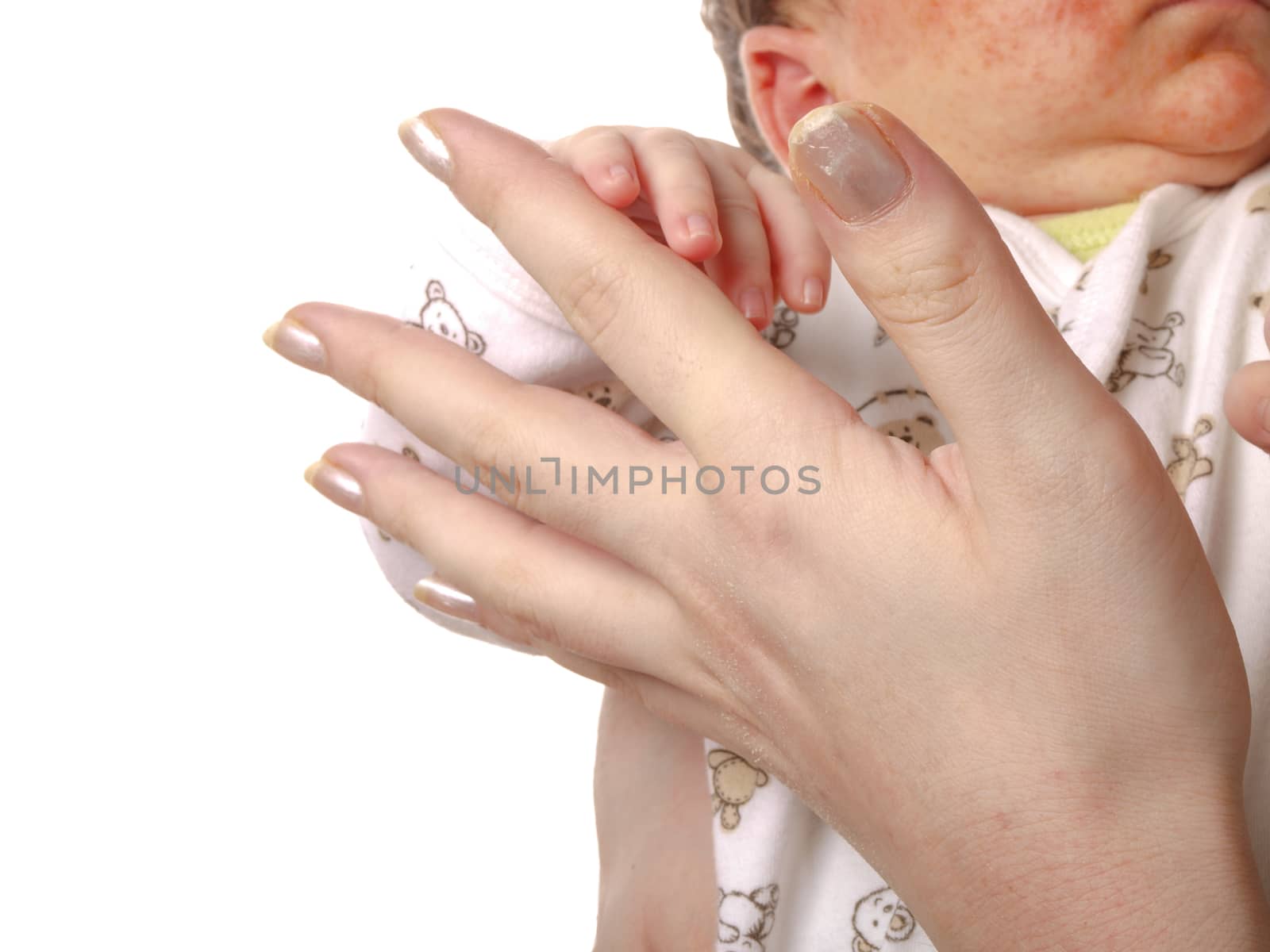 Mother playing with newborn baby, holding hands, towards white