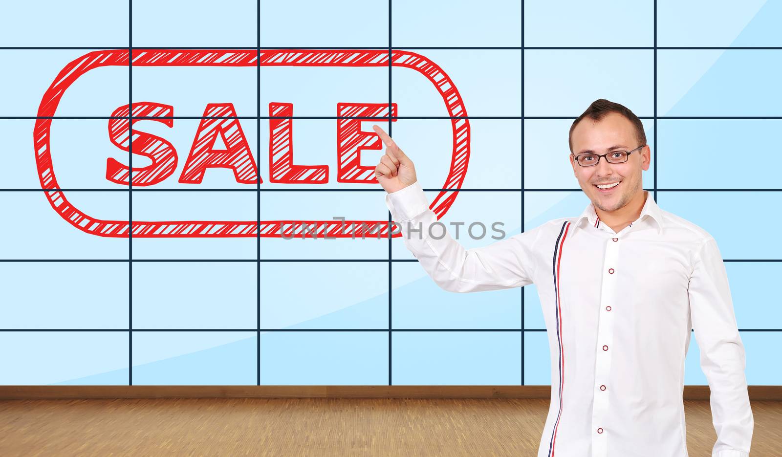 happy man pointing at plasma wall with sale symbol