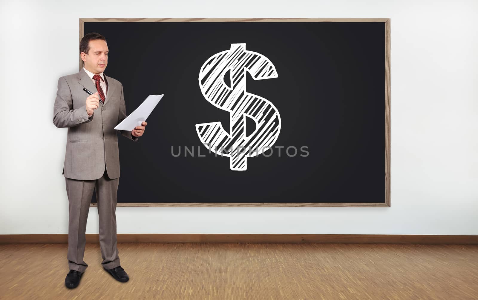 businessman standing in office and dollar on blackboard