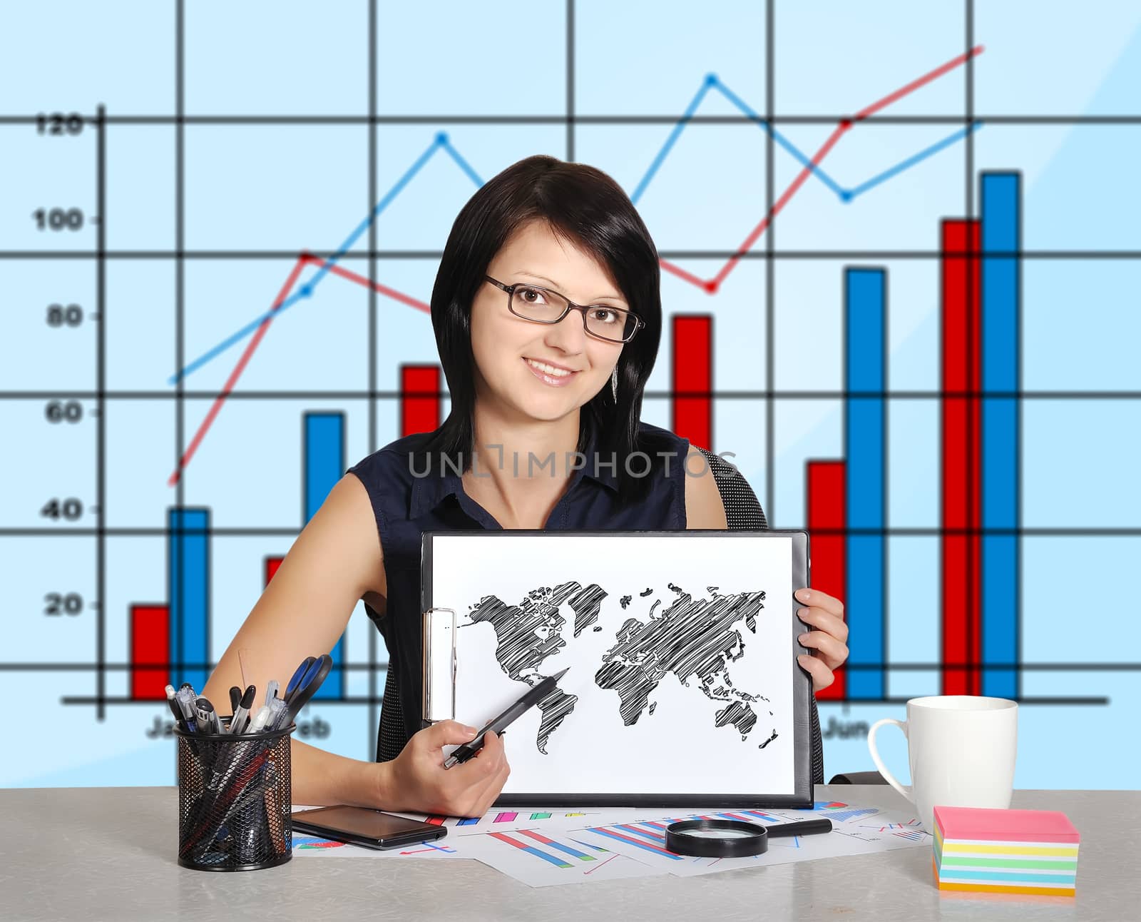 woman sitting in office and world map on clipboard