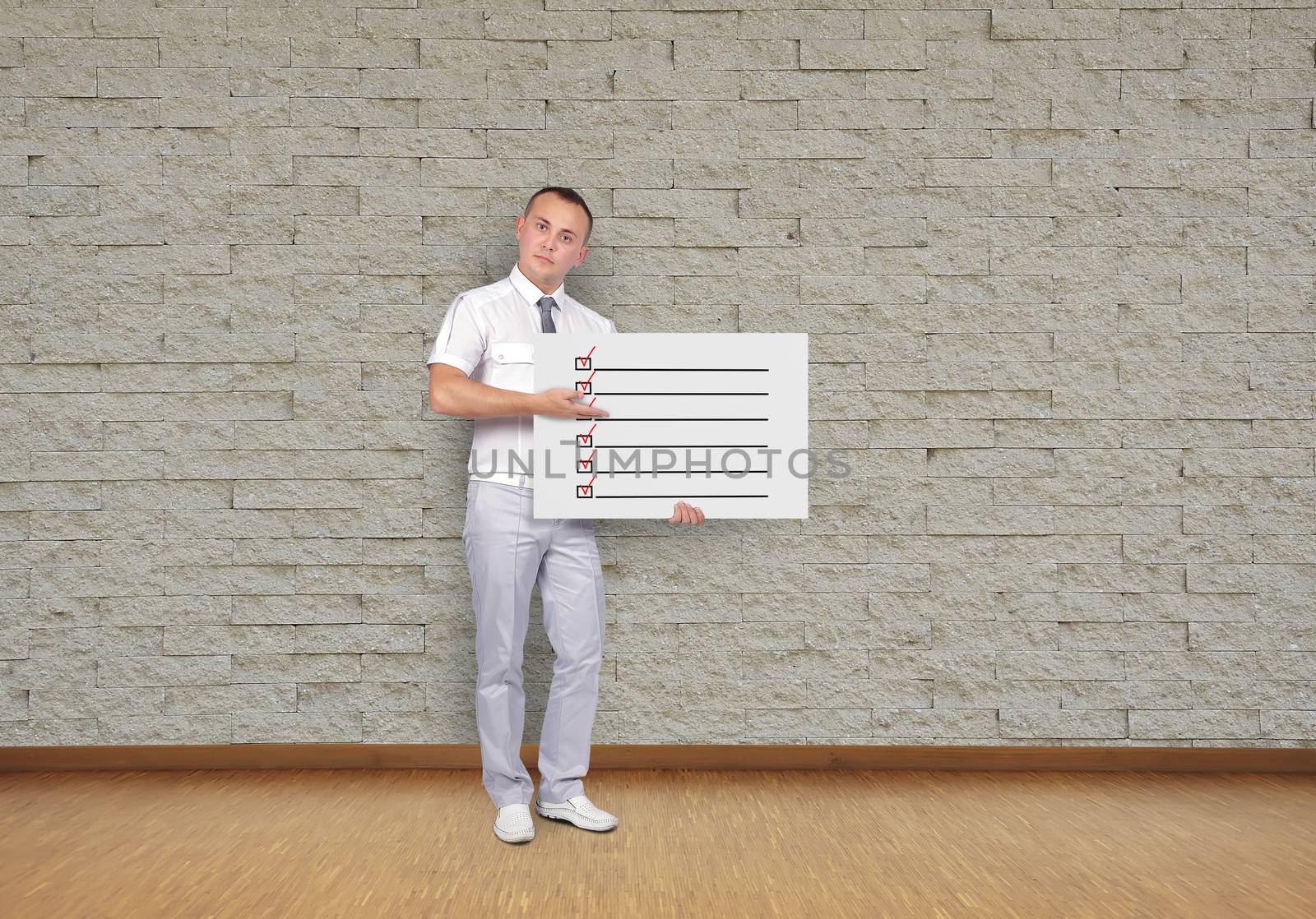 businessman holding placard with check box