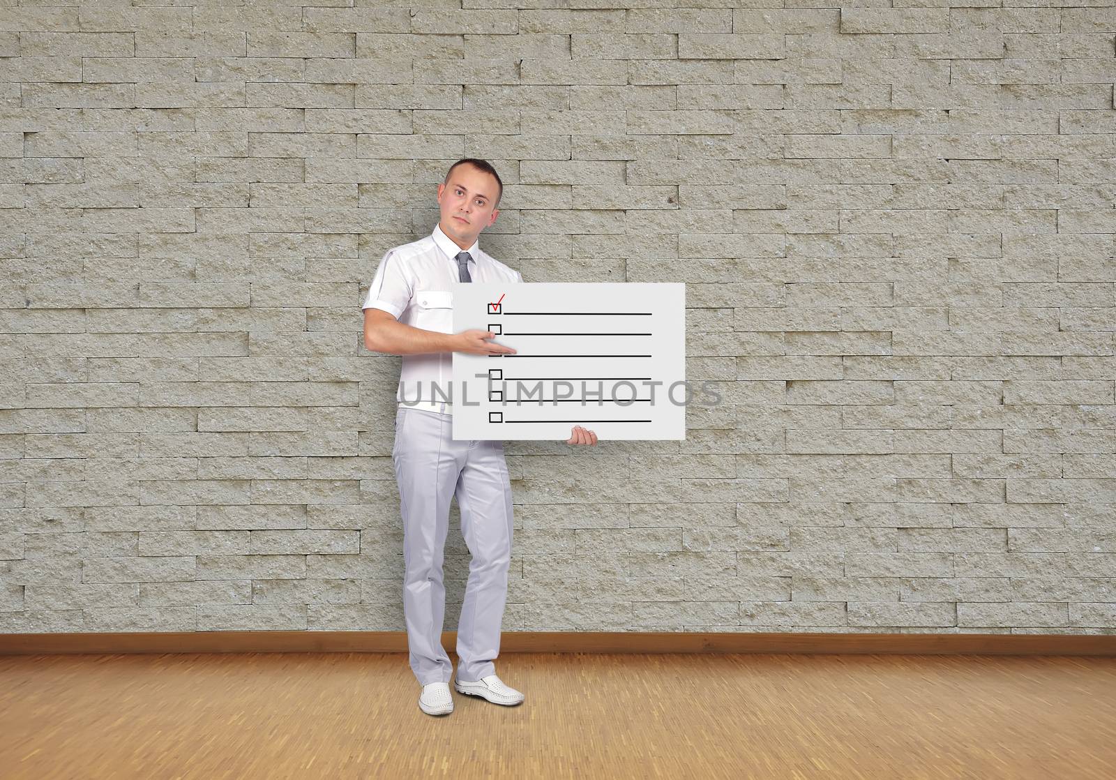 businessman holding placard with check box
