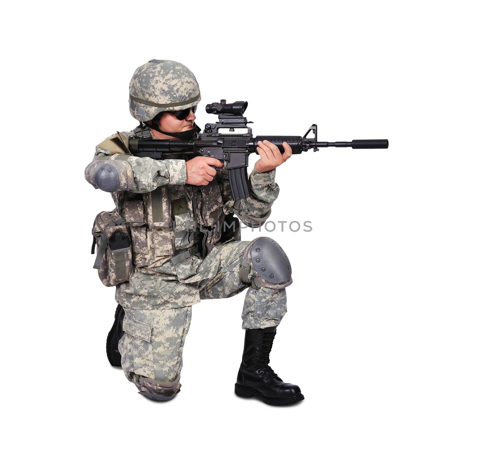 soldier with his assault rifle on white background