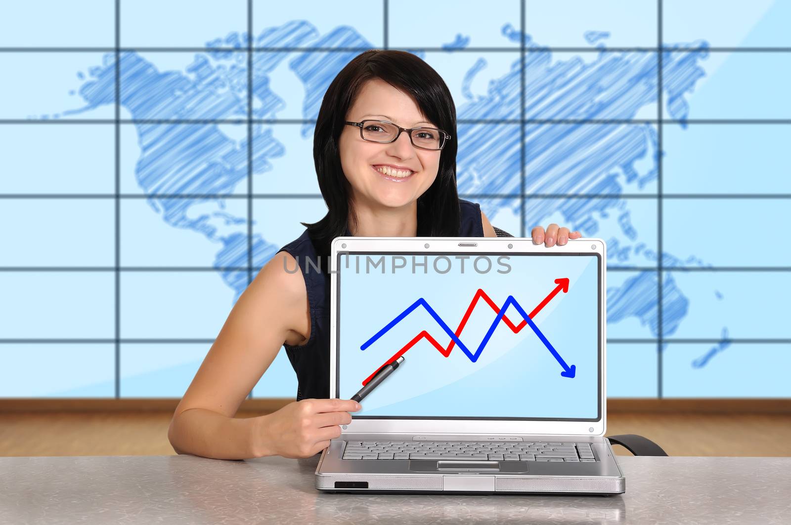 woman sitting in office and laptop with chart