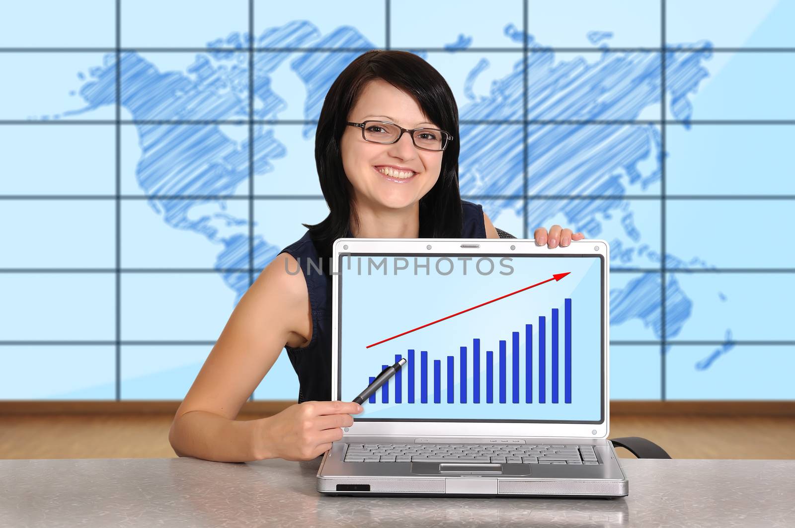 woman sitting in office and laptop with chart