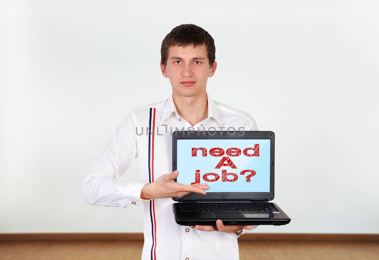 boy holding laptop with need a job