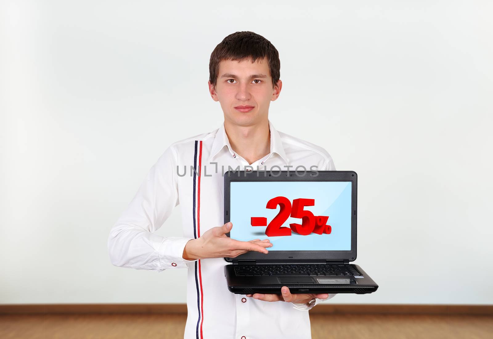 boy holding laptop with discount on screen