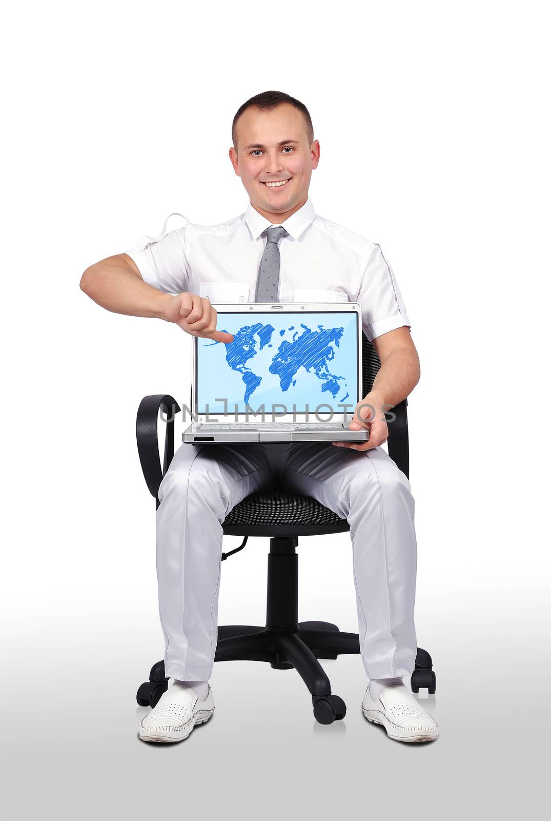 man sitting on chair and holding laptop with world map