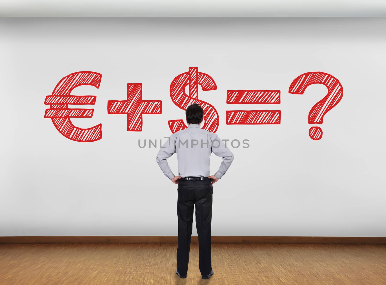 businessman in office looking at wall with business formula