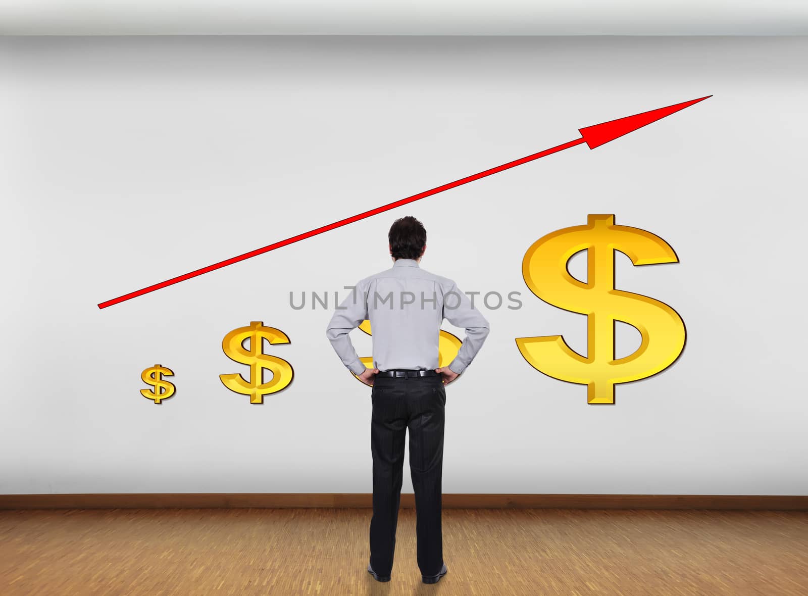 businessman in office looking at wall with chart