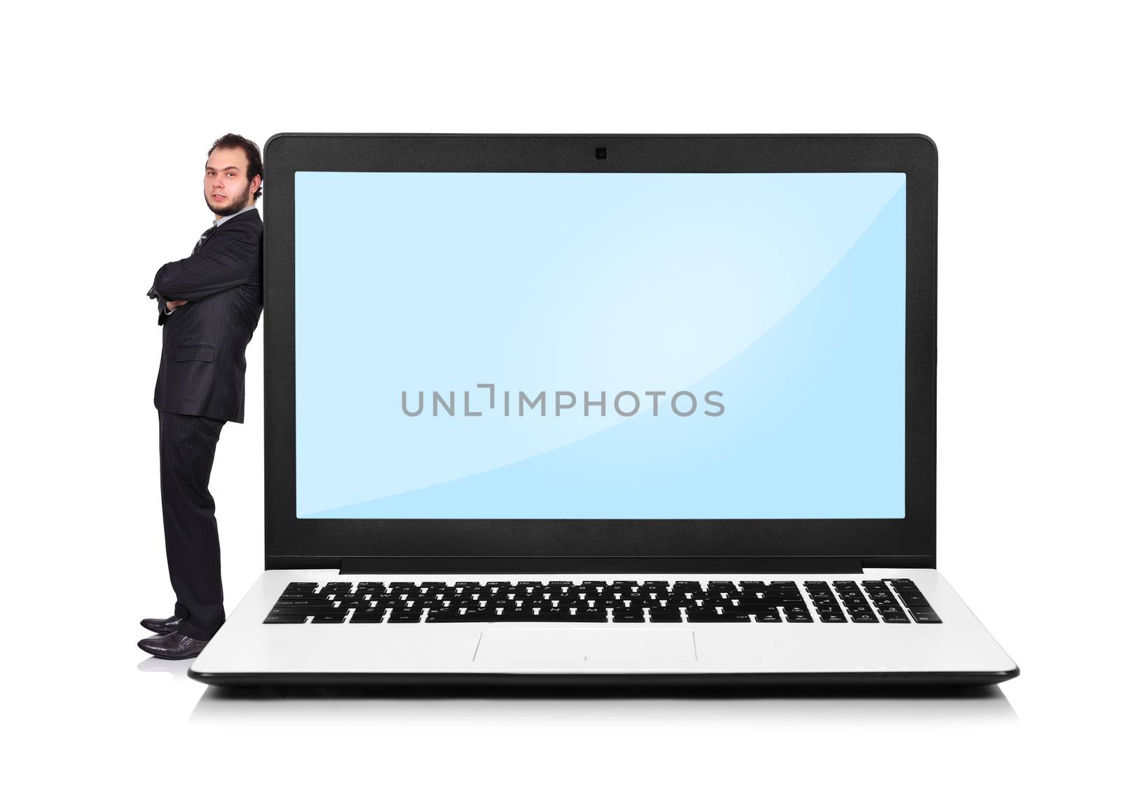 Businessman leaning on a laptop by vetkit