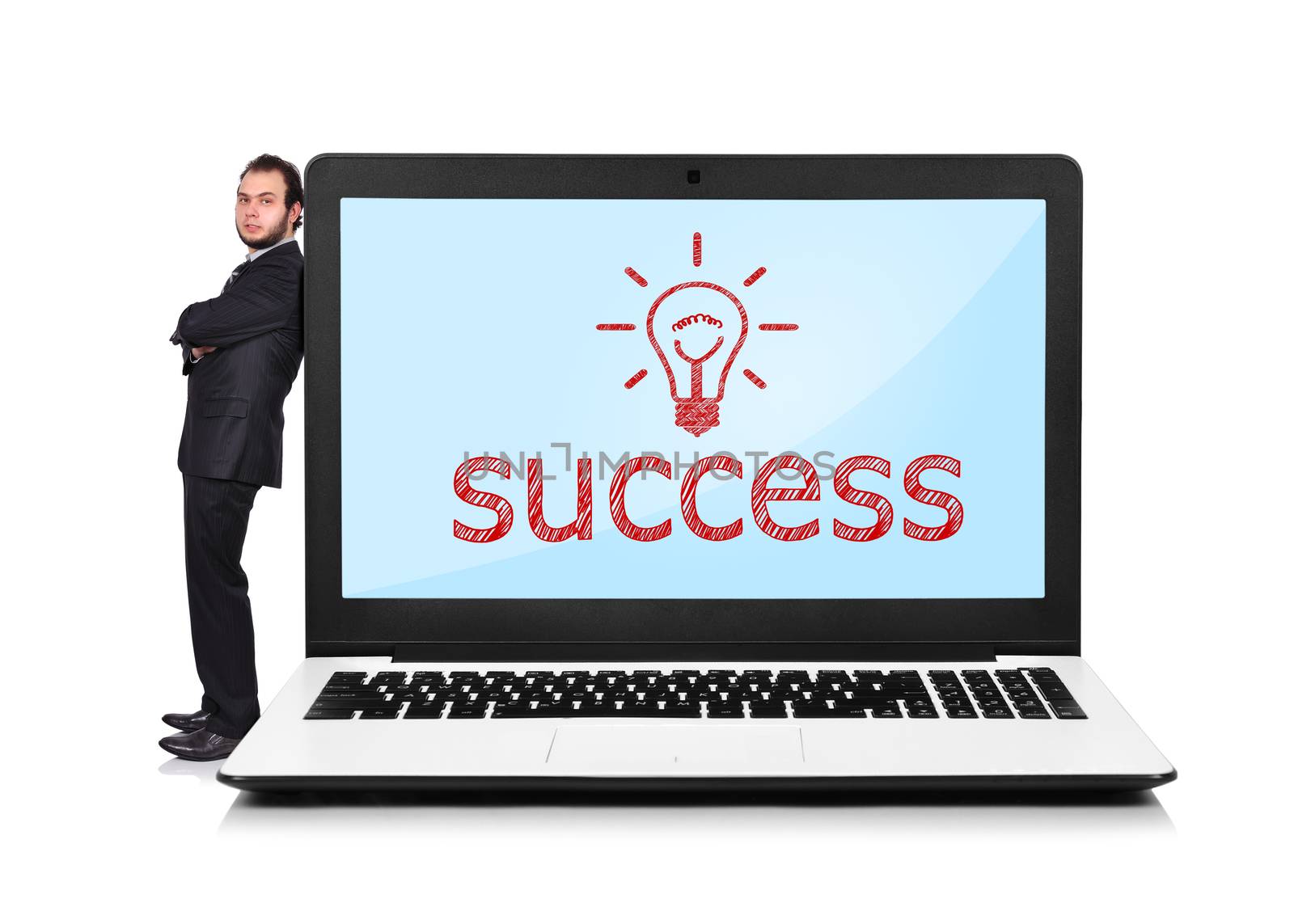 Businessman leaning on a laptop with success