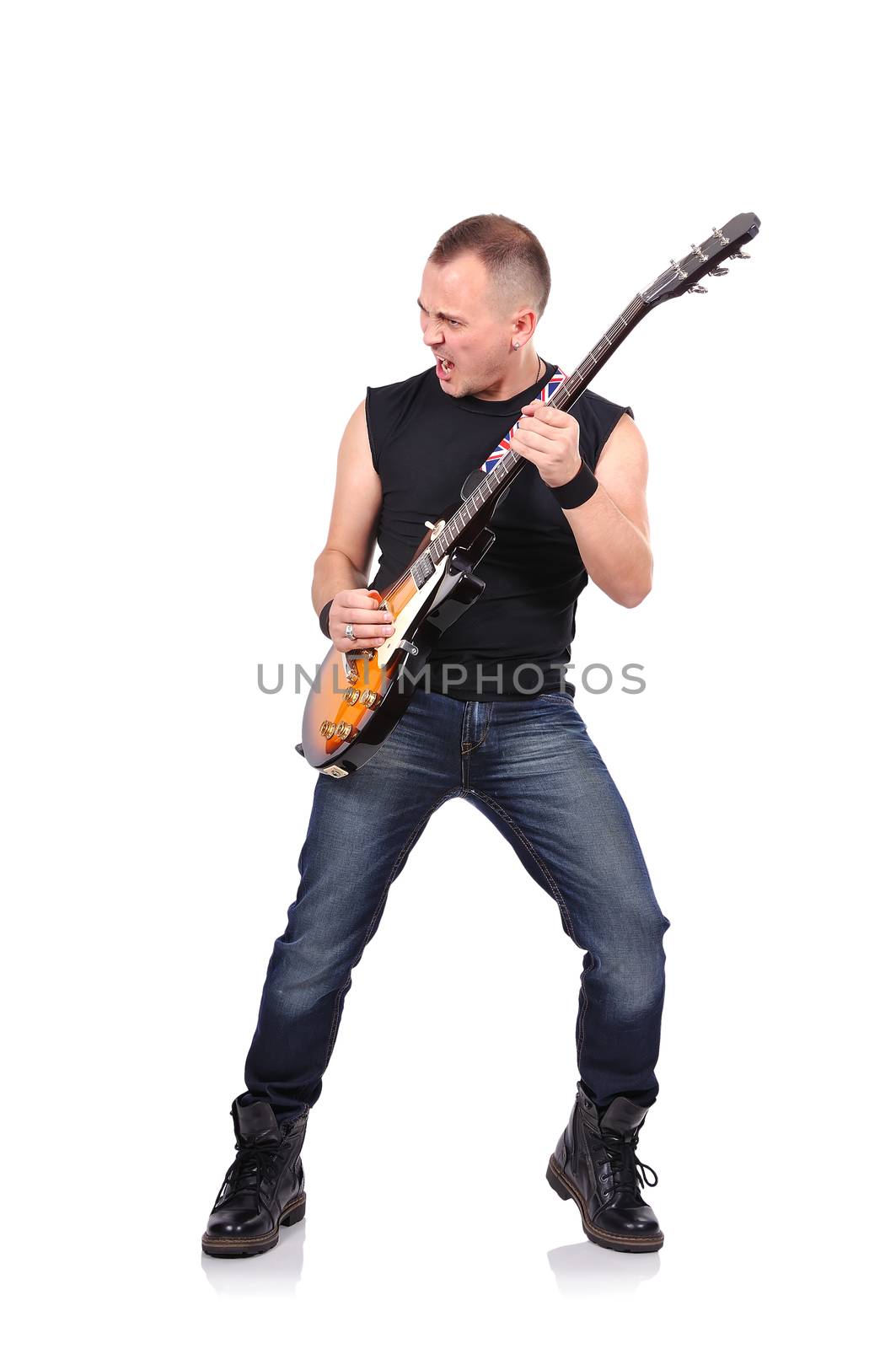 young rock musician is playing electrical guitar