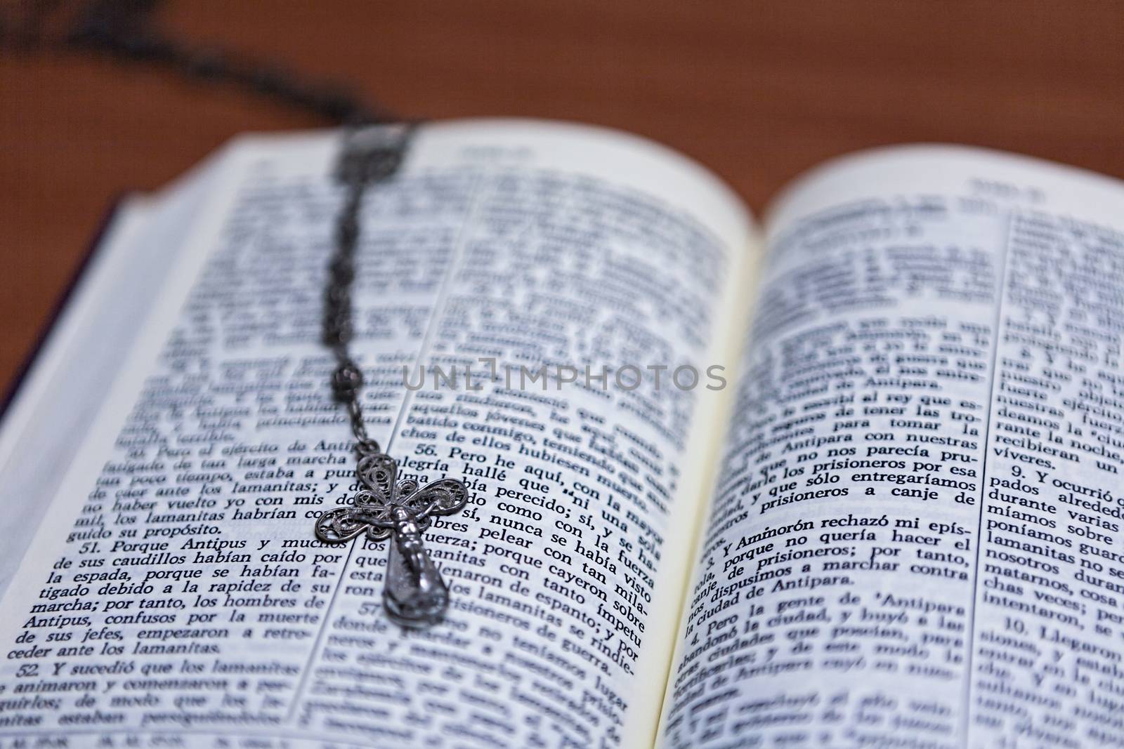 Rosary beads and a holy bible by digicomphoto