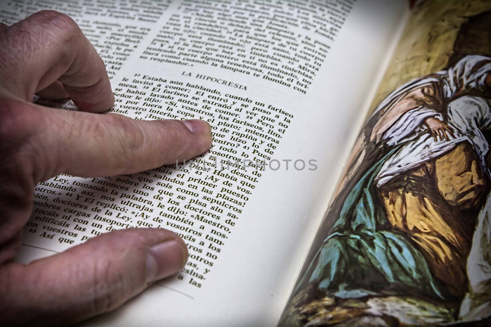 Rosary beads and a holy bible by digicomphoto