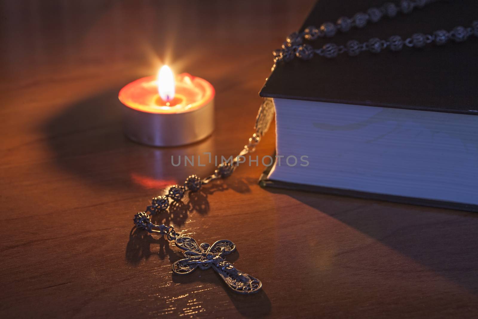 Rosary beads and a holy bible by digicomphoto