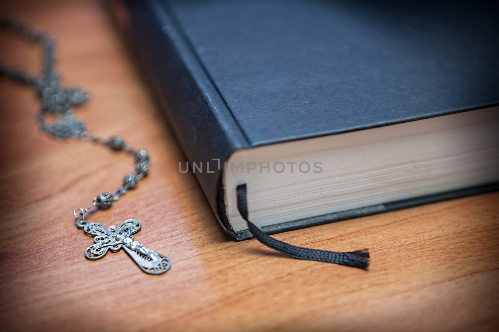 Rosary beads and a holy bible