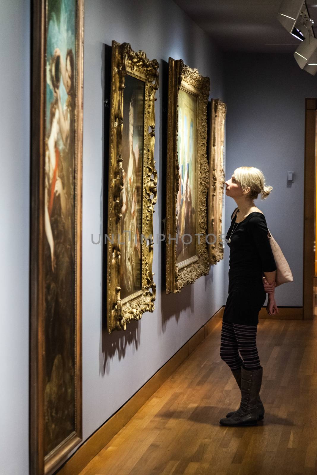 Editorial - Montreal, Canada - Montreal Fine Arts Museum Room with Paintings on the wall and Young Adult looking at it.