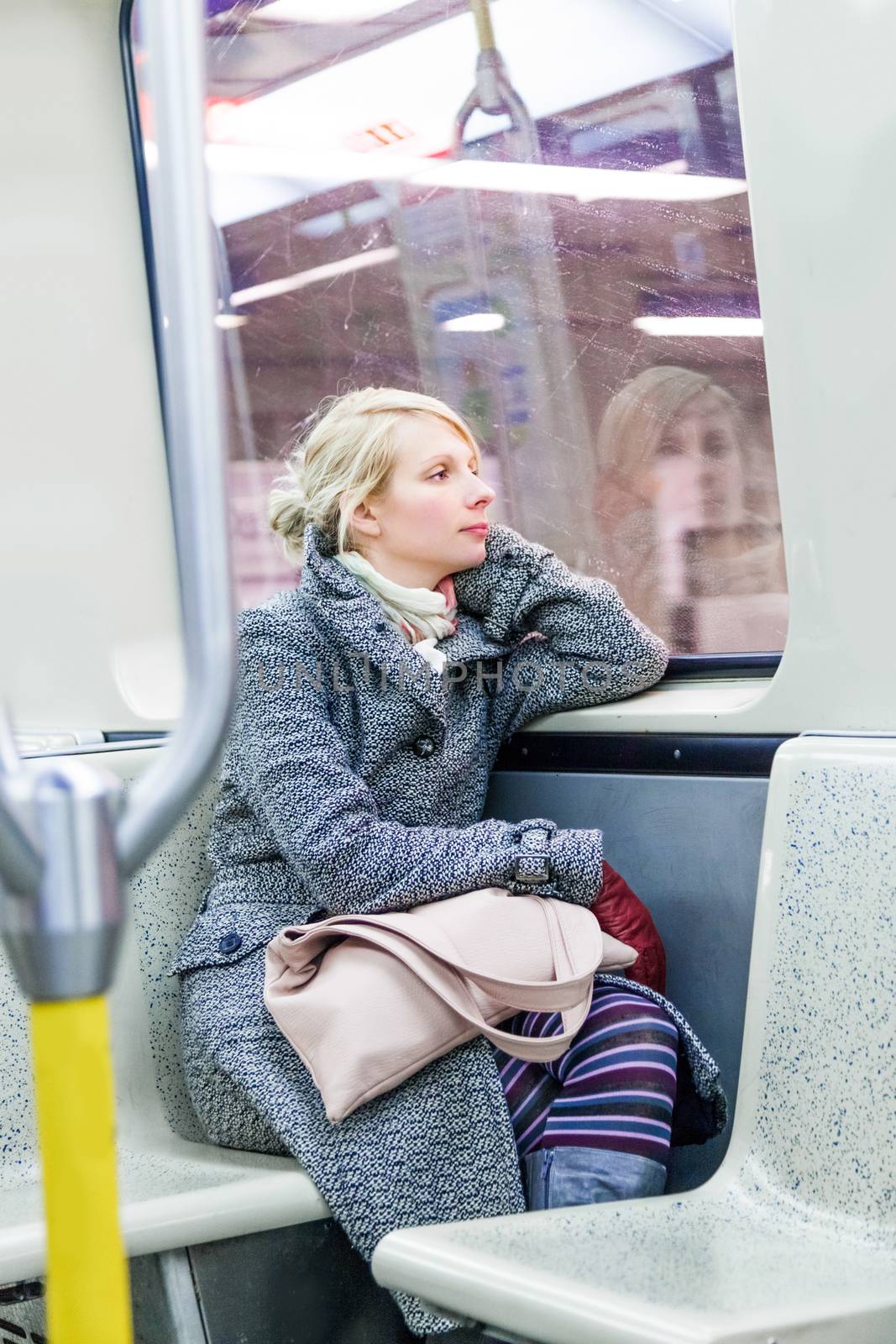Young Woman Sitting inside a Metro Wagon by aetb