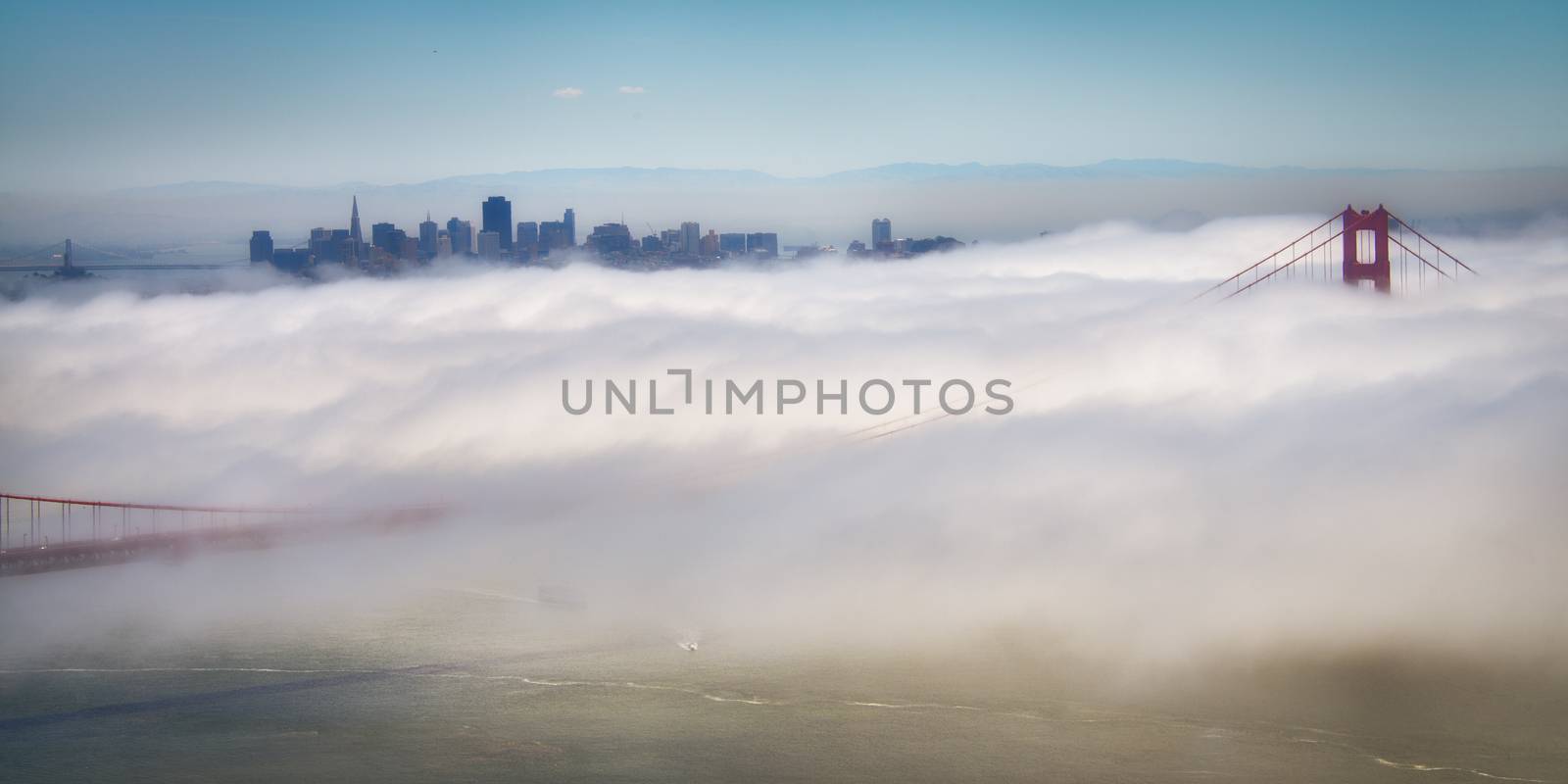 Golden Gate Bridge with skyscrapers in the background, San Francisco Bay, San Francisco, California, USA