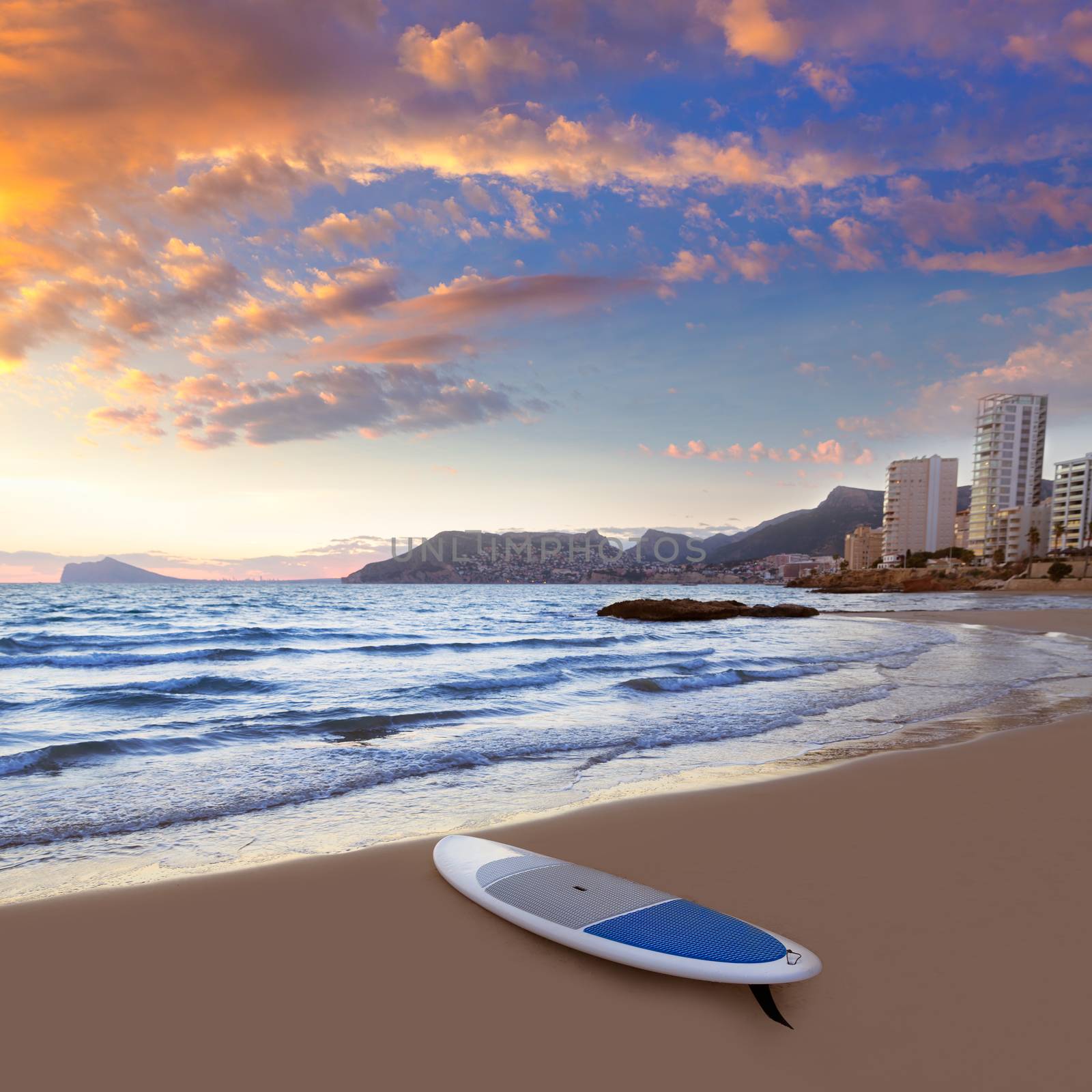 Calpe Alicante sunset at beach Cantal Roig in Mediterranean Spain with paddle sufboard