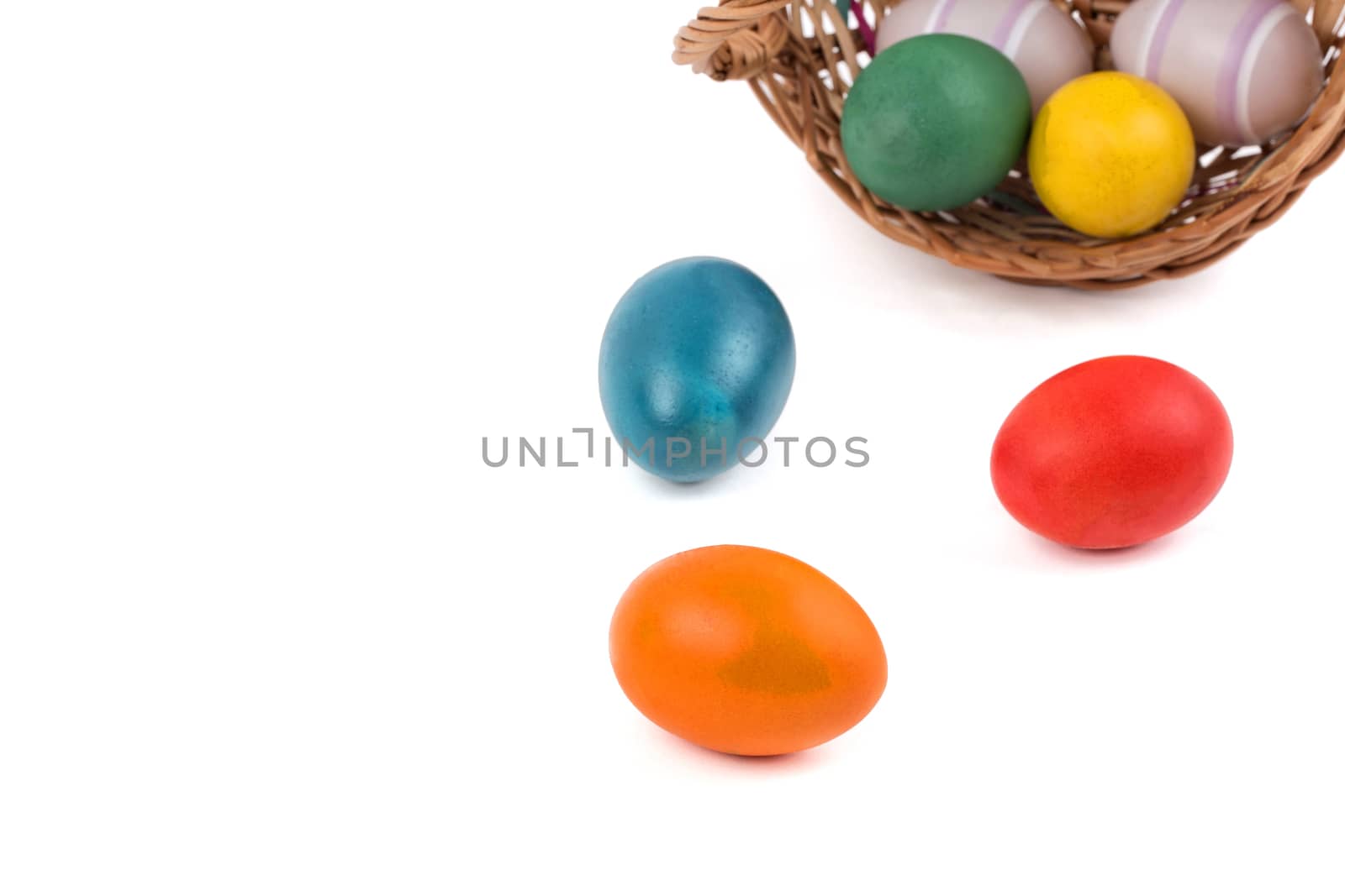 A colourful easter eggs in a overturned basket