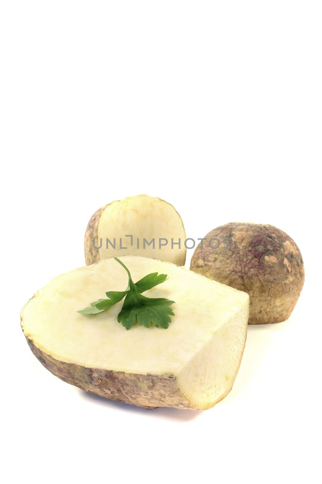 yellow rutabaga with parsley on a bright background