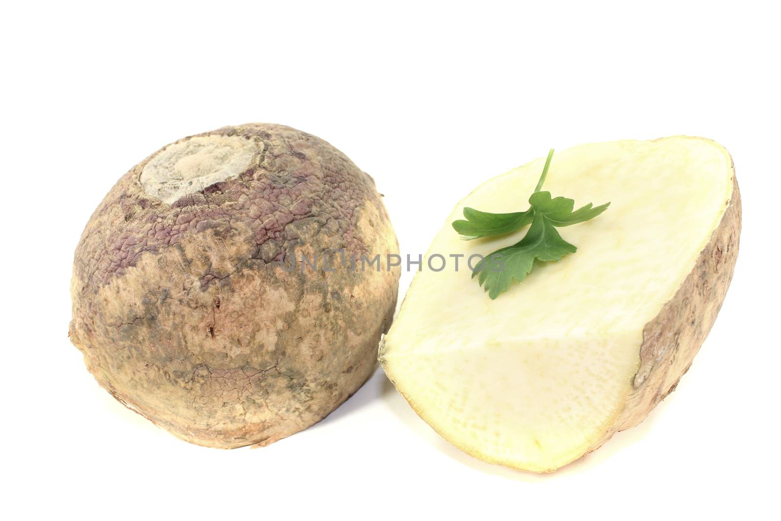 two rutabaga with parsley on a bright background