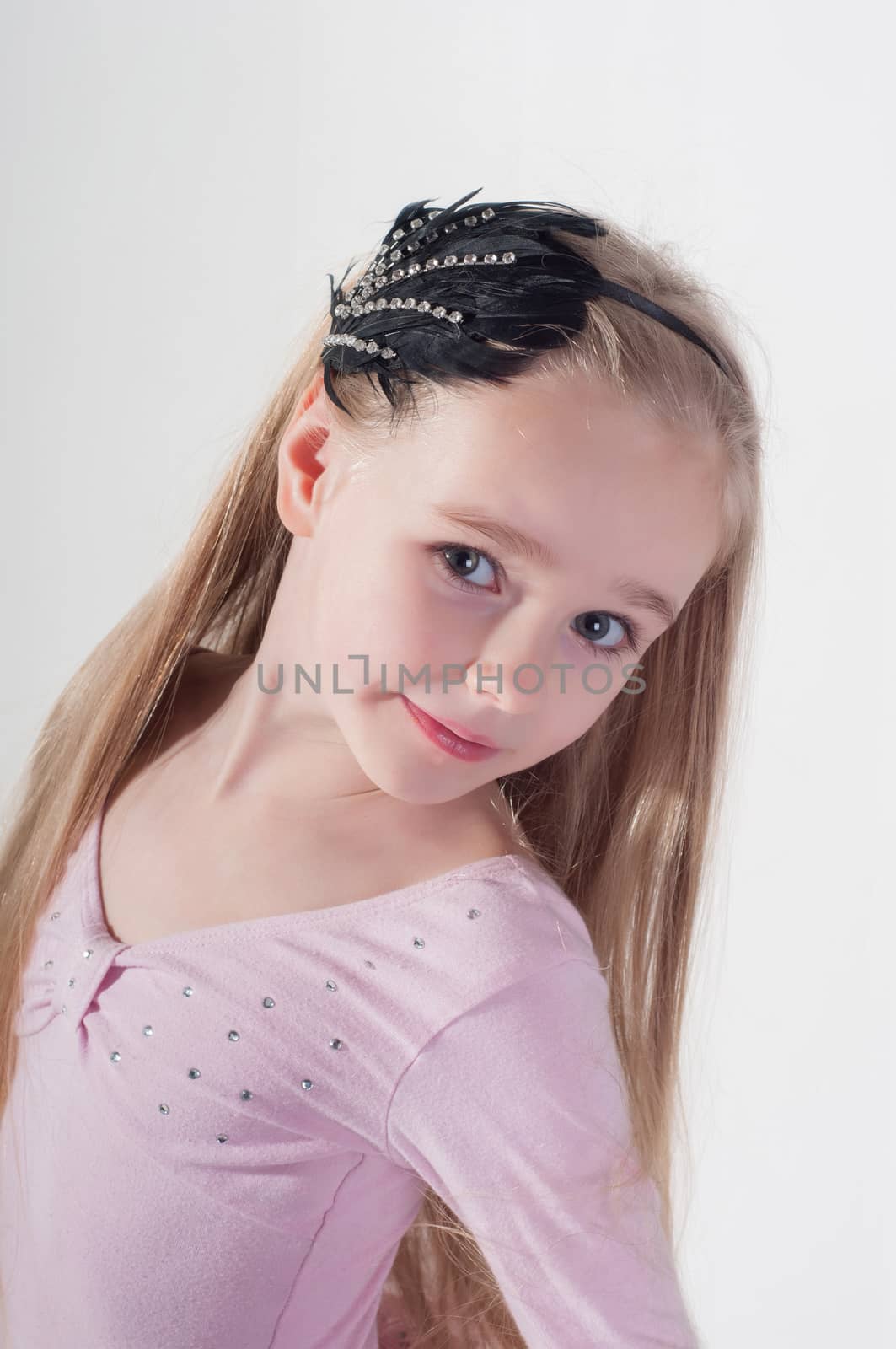 Portrait in blond girl with long hair in studio