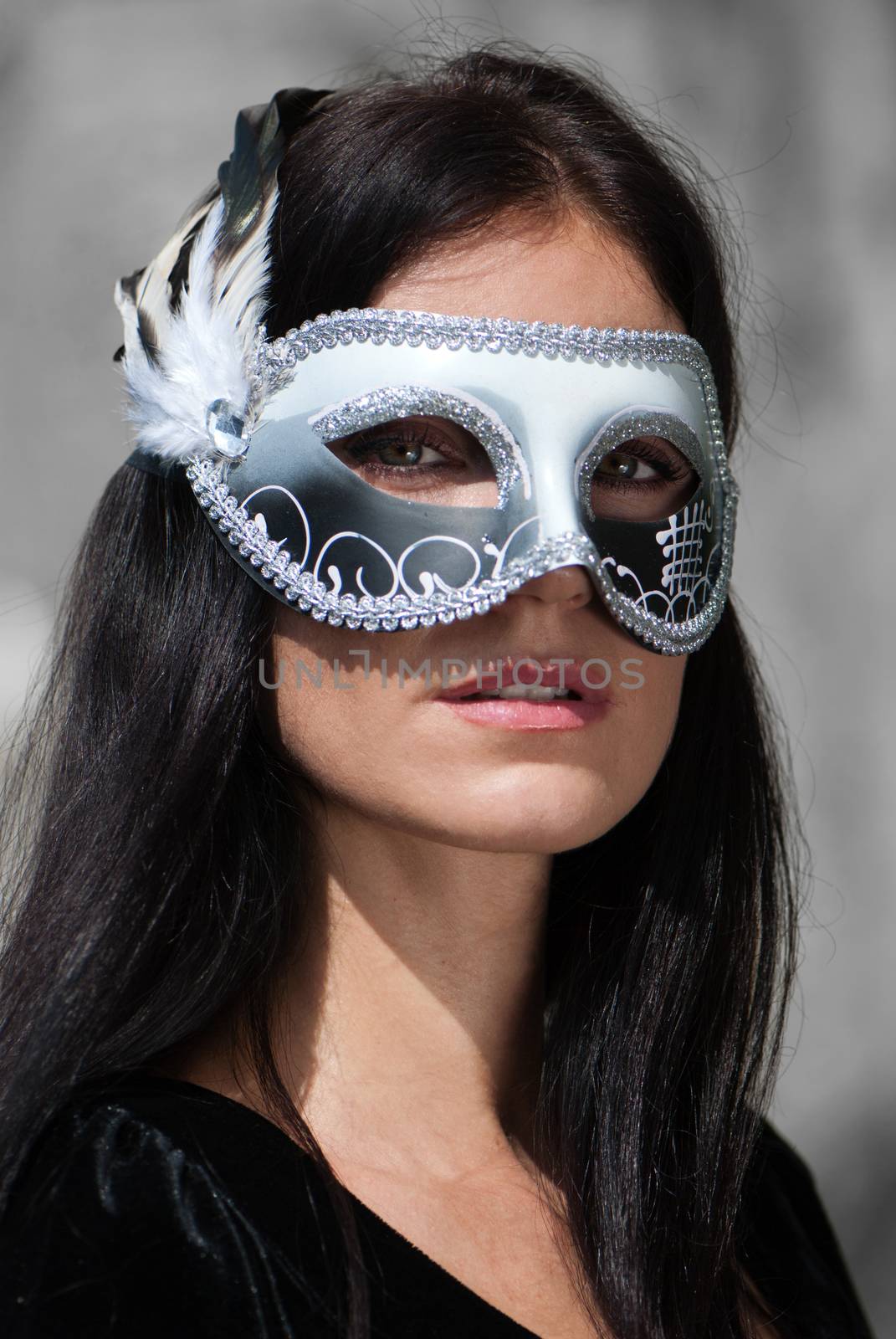 Portrait beautiful woman in black dress wearing carnival mask by Anpet2000