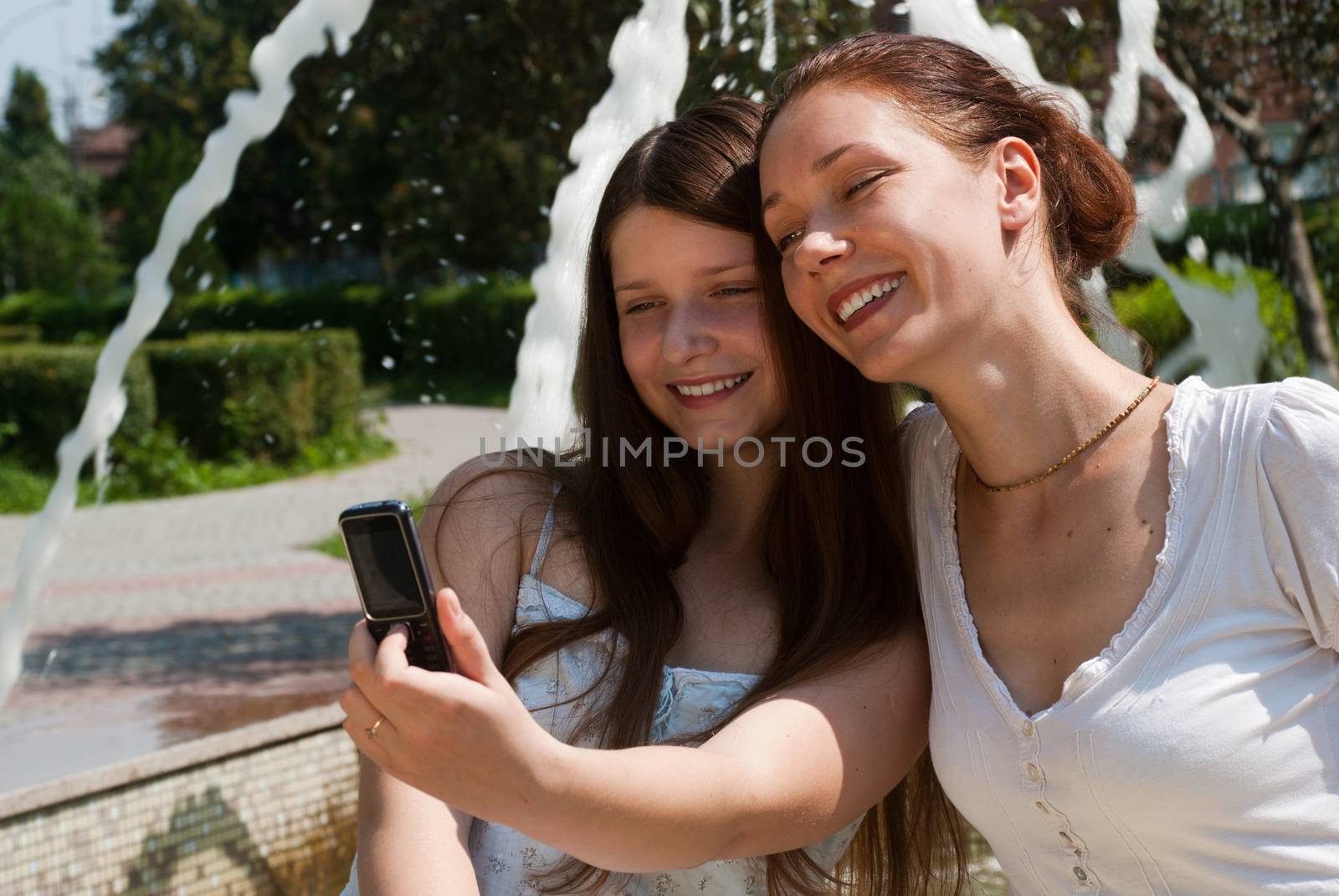 Happy mother and daughter in park