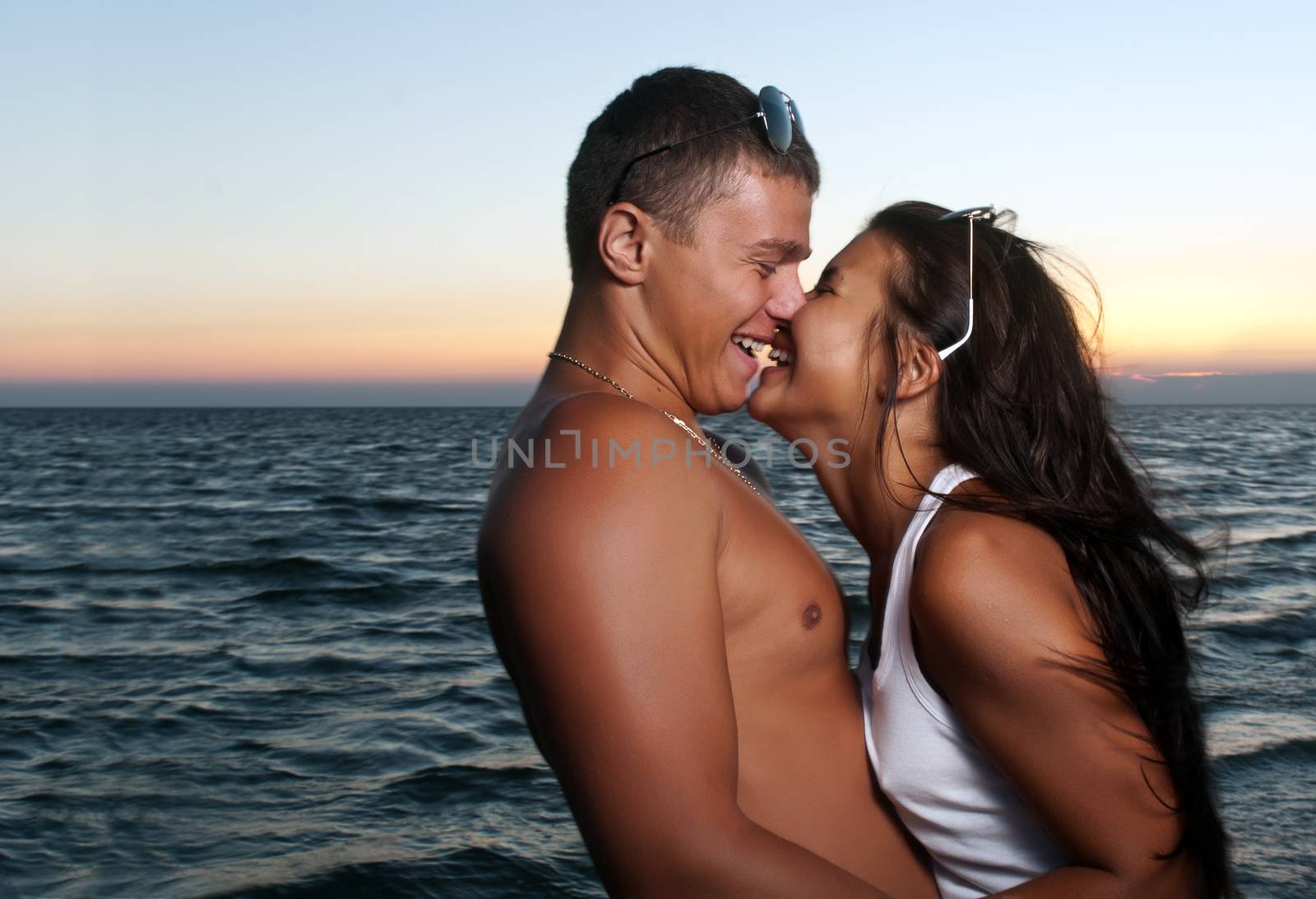 Closeup portrait of happy couple enjoying vacations by Anpet2000