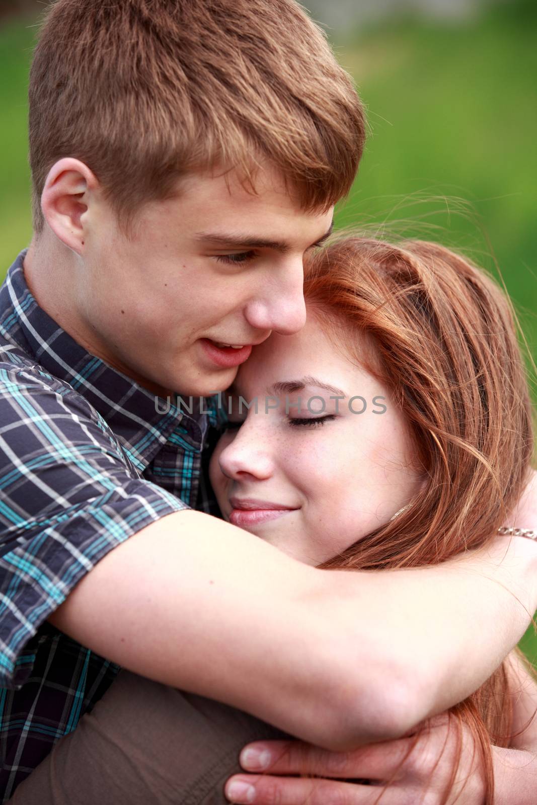 Portrait happy young teenage couple outdoor