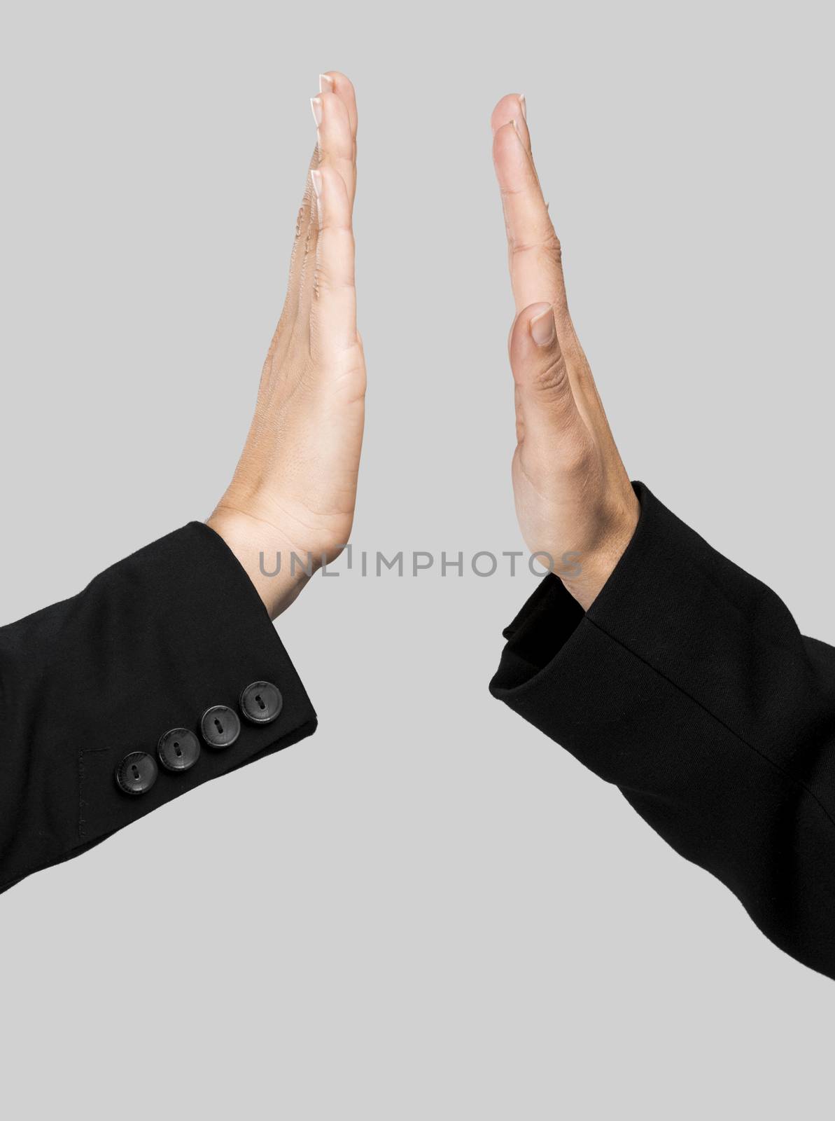 Hands making a give me five compliment over a gray background
