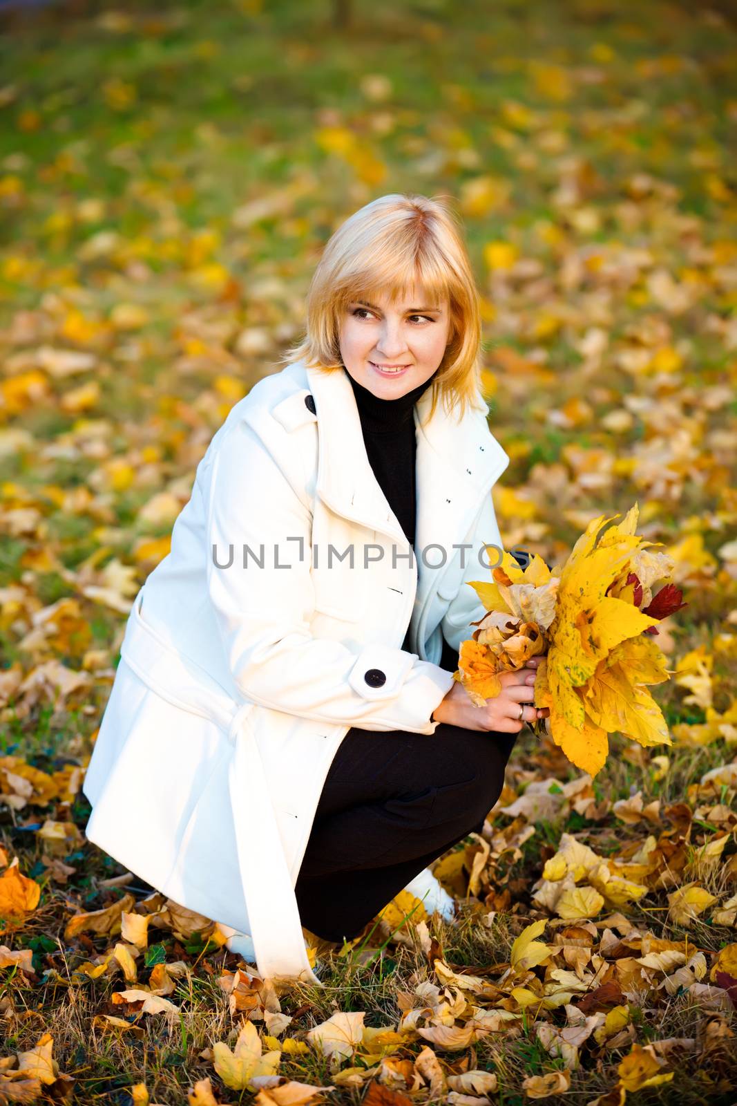 portrait of pretty woman in autumn park 