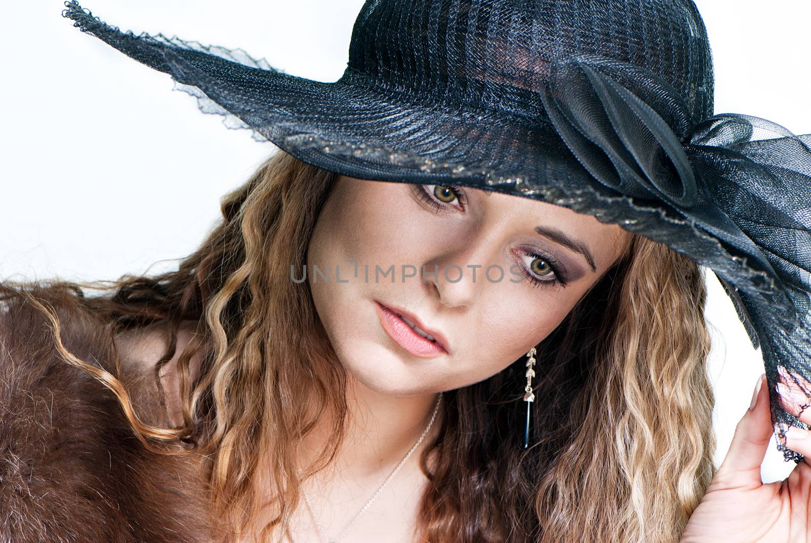 Young woman in a hat portrait