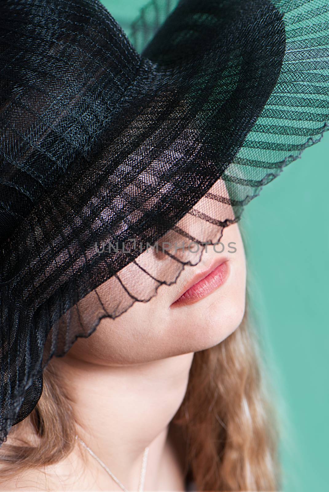 Young woman in a hat portrait