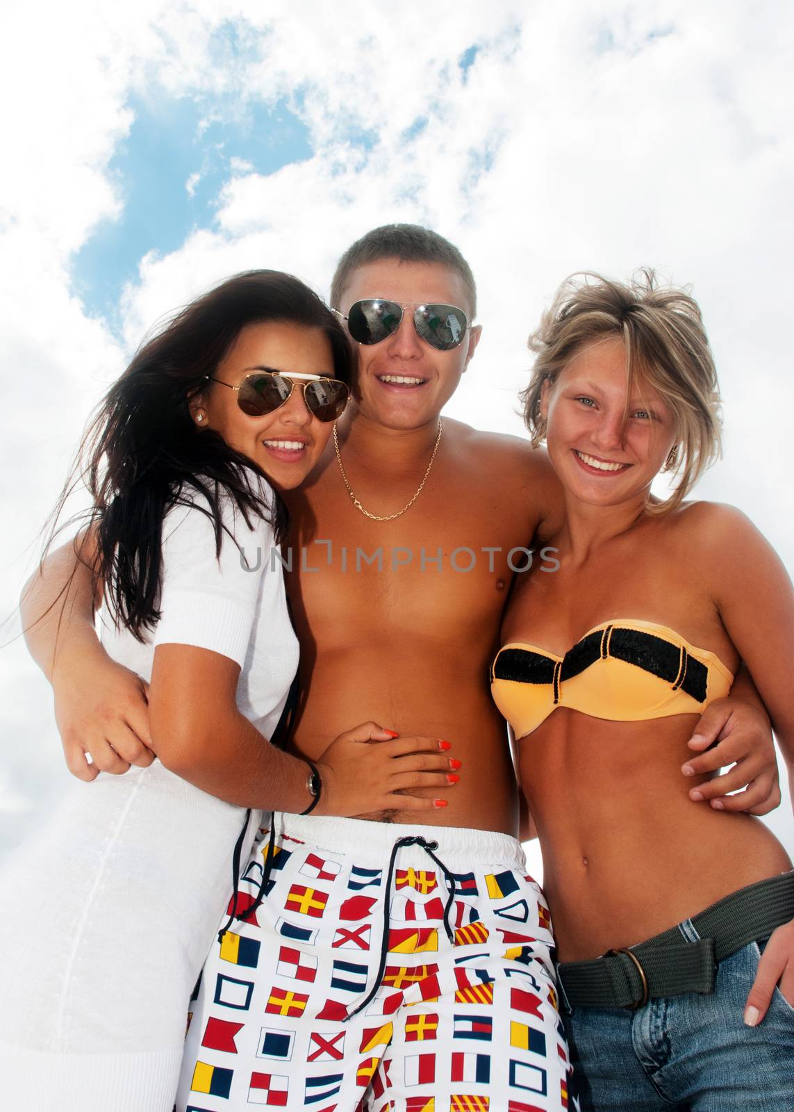 Closeup portrait of happy friends enjoying vacations  by Anpet2000
