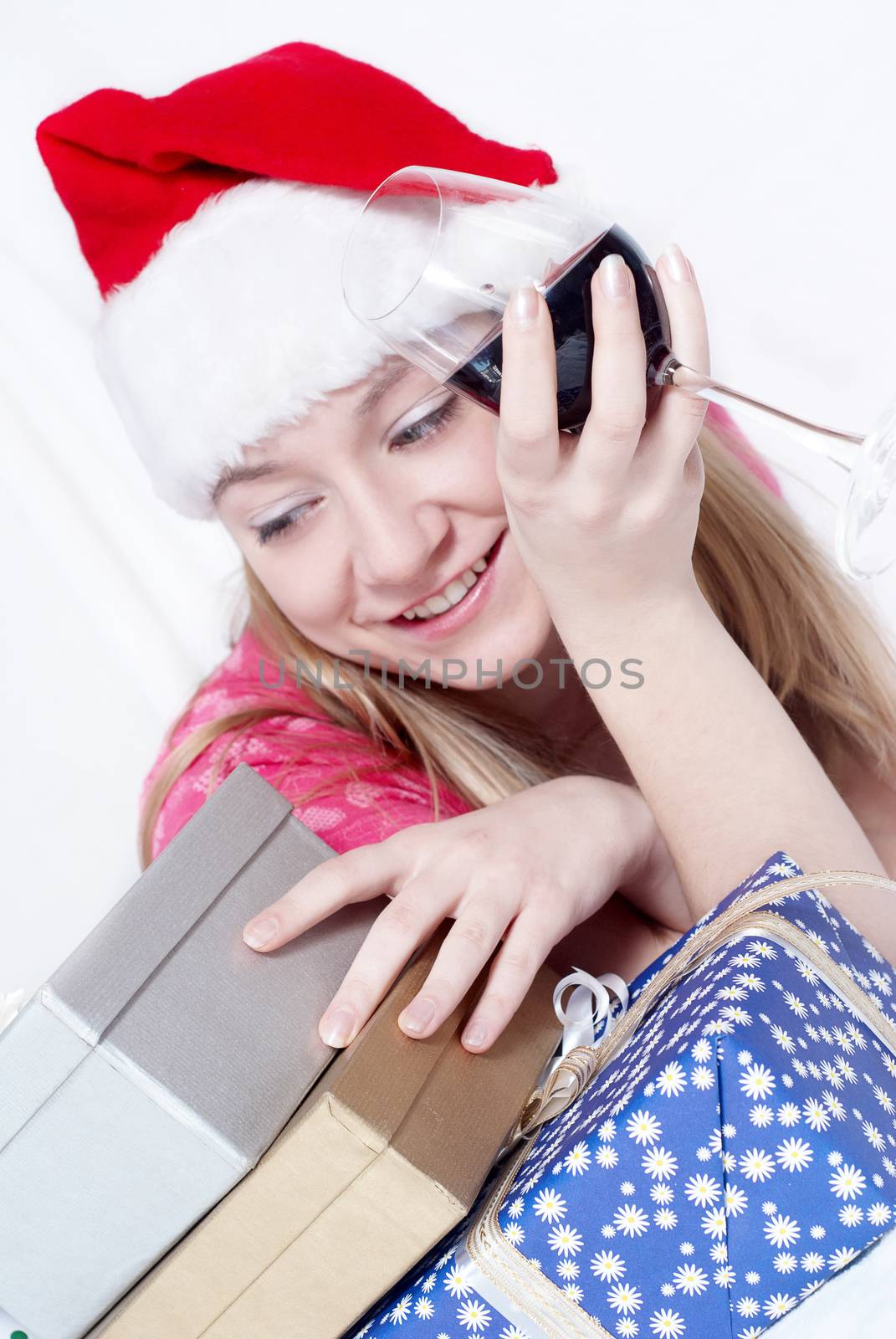 Mrs. Santa Clause With New Year's gifts and Wine glass