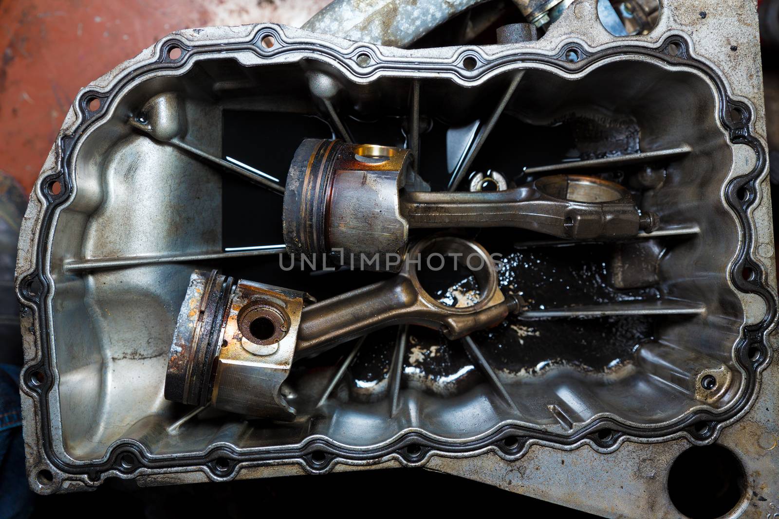 Open car engine with cylinders piston and rod of used car repair