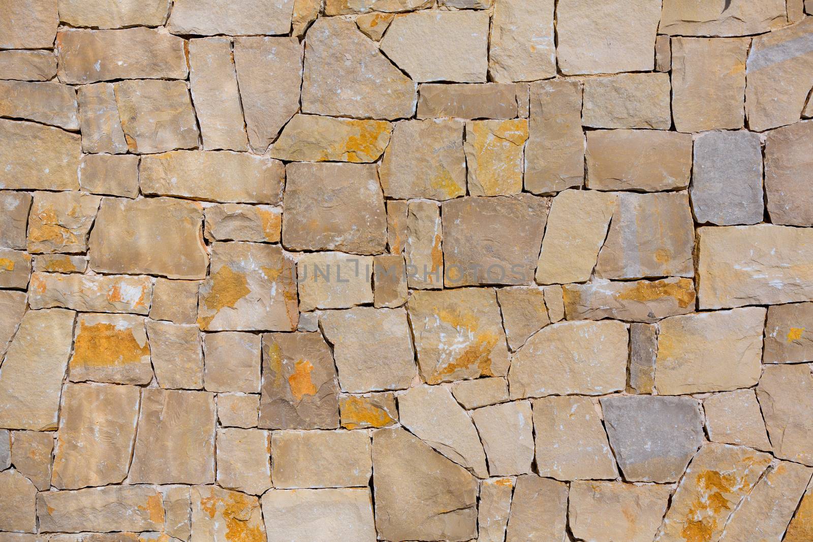 Masonry wall textre of handmade stones traditional style in Spain