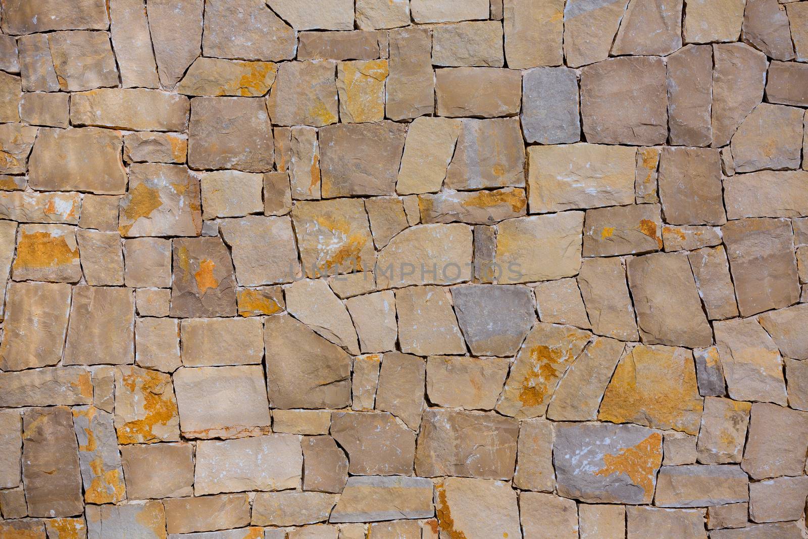 Masonry wall textre of handmade stones traditional style by lunamarina